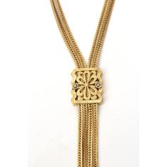 This is part of Chairish’s Fine Jewelry assortment.  This signed vintage Monet lariat gold filled necklace now is so chic. It is from the 60's. The chain form on each strand is elegant. The lariat medallion can go up and down to secure different placement. It has the 4 drop pendant forms at the end. It is 17.5" H / L on the neck. Lariat necklaces are very in vogue now. Gold-tone Luxury Lariat Necklace For Formal Occasions, Luxury Gold-tone Lariat Necklace For Formal Occasions, Elegant Yellow Gold Lariat Necklace In Brass, Elegant Yellow Gold Brass Lariat Necklace, Vintage Lariat Jewelry With Adjustable Chain, Vintage Yellow Gold Multi-strand Jewelry, Gold Brass Lariat Necklace, Elegant Brass Lariat Necklace As Gift, Elegant Gold Medallion Chain Necklace