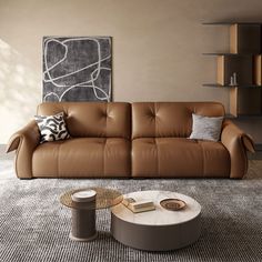 a living room with a couch, coffee table and bookshelf on the wall