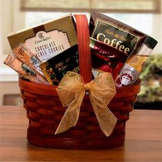 a basket filled with coffee and snacks on top of a table