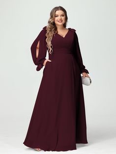 a woman in a long dress with sleeves on