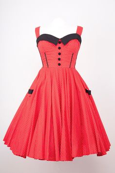 Exclusive to Doghouse Vintage this full circle Rock and Roll dress is vibrant red with white dots, black trim to bust line,ric rac braid in black runs down the front bodice, Back zip and Elasticated panels at the side, Pretty details on front, covered buttons in black and a half waist belt,ties at the back Adjustable strap length, Quality cotton used throughout. Fitted Polka Dot Dress For Costume Party, Red Sleeveless Rockabilly Dress, Retro Red Dress For Costume Party, Rock And Roll Dress, Rock And Roll Dresses, Roll Dress, Rock And, Circle Dress, Ric Rac