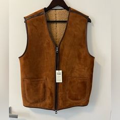 This Vest Is Called The Fox And It Was Homecore Paris’ Signature Vest. It’s Made Of 100% Sheepskin. - Suede - Leather Trimmings - Shearling Interior Chest - 21.5” Hem - 20.5” Shoulder - 17.5” Length - 26” Brown Sheepskin Outerwear For Work, Sheepskin Vest, Shearling Vest, The Fox, Suede Leather, Mens Jackets, Jackets & Coats, Fox, Paris