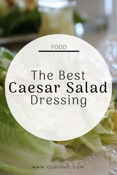 the best caesar salad dressing recipe on a white plate with lettuce and tomatoes