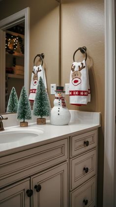 a bathroom vanity with christmas decorations on it