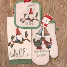 three oven mitts with gnomes on them and one has an oven mitt that says gnome for the holidays