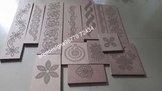 several pieces of laser cut paper with designs on the side and one piece in the middle