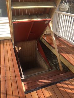 a wooden deck with an open door on it