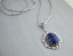 Lapis Lazuli Necklace. Cabochon measures 18x13mm. Pendant measures 32x25mm. Chained in nickel free silver plated chain. Closes with a lobster clasp. Length pictured is 18 inches long. See the matching earrings here: https://www.etsy.com/your/shops/WearitoutJewelz/tools/listings/stats:true/675449046 Visit my shop today to see other great items. :) http://www.etsy.com/shop/WearitoutJewelz ♥ All items carefully packaged in a pretty gift box. Lapis Jewelry, Lapis Lazuli Jewelry, Lapis Lazuli Earrings, Lapis Lazuli Necklace, Necklace Gemstone, Pretty Gift, Dream Clothes, Gemstone Necklace, Matching Earrings