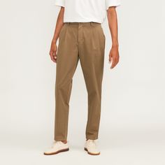 Pleated and put together. Our top-performing chinos are now available in a new, lightweight organic cotton that’s perfect for warm weather. We added single front pleats to the tapered legs for a more elevated look. The Organic Cotton Pleated Chino features two front-slant pockets and back welt pockets with a button closure, and a zipper front and button closure. Organic cotton uses crop rotation, cover crops, and organic fertilizers instead of toxic chemical fertilizers or pesticides—which m Spring Everyday Relaxed Fit Chinos, Relaxed Fit Tapered Leg Everyday Chinos, Everyday Relaxed Fit Tapered Leg Chinos, Classic Chinos For Business Casual In Summer, Classic Summer Chinos For Business Casual, Everlane Cotton Bottoms With Pockets, Relaxed Fit Chinos In Chino Cotton Twill For Spring, Summer Tapered Leg Chinos In Chino Cotton Twill, Relaxed Fit Chino Cotton Twill Chinos For Spring