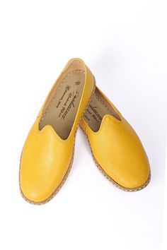 These canary yellow 100% handcrafted shoes, made from high-quality natural leather, will make you feel comfortable. Our authentic loafers, crafted with amazing craftsmanship, are not only a great gift for friends and family but also for yourself. The superior stitching style we use takes more time but reflects the quality we are proud of. Our traditional shoes are suitable for wearing both inside and outside. Wanna see more Charooq for men? Check out the link! https://www.etsy.com/your/shops/Cha Yellow Leather Closed Toe Clogs, Yellow Flats With Leather Sole And Round Toe, Yellow Round Toe Flats With Leather Sole, Yellow Slip-ons With Round Toe, Yellow Slip-on Moccasins With Rubber Sole, Yellow Leather Slip-ons With Round Toe, Yellow Leather Loafers With Flat Heel, Yellow Leather Flat Loafers, Yellow Moccasins With Rubber Sole And Round Toe