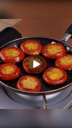 tomatoes being cooked in a pan on top of an electric stove with the lid open