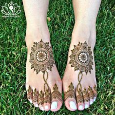 the feet are decorated with henna designs