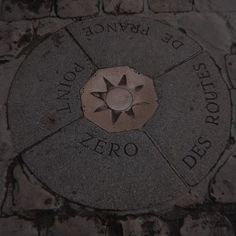 a brick sidewalk with the words zero written on it and a star in the center