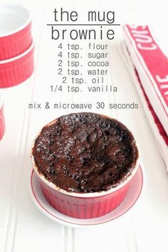 a brownie in a red dish on a white table