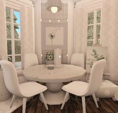 a white table and chairs in a room