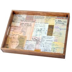 an old wooden box with many papers on it