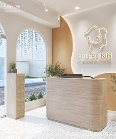 the front desk of a skin clinic with an arched window and large sign above it