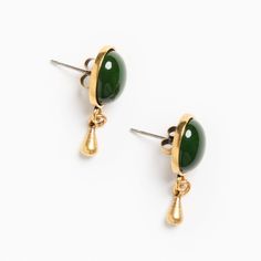 Inspired by the quietly romantic, brass-drop earrings and mossy shades of green found in oil paintings across Europe, these earrings feature the same green charm as our Aristocrate pieces hold, but with a delicate golden drop hanging from below. Materials & Dimensions Flash plated antiqued gold over brass ; German glass stone Green Charms, Lovers Eyes, Modern Muse, Moss Green, Gold Drop Earrings, Charm Earrings, Earring Necklace, Ring Necklace, Shades Of Green