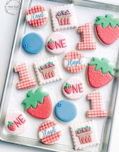 some decorated cookies in a tray on a table