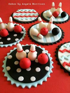 some cupcakes that have been decorated to look like bowling pins