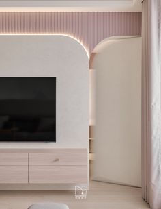 a large flat screen tv mounted to the side of a wall in a living room