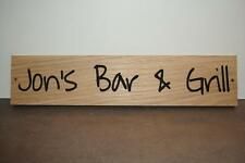 a wooden sign that says jon's bar and grill