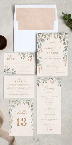 the wedding stationery is laid out on top of an envelope