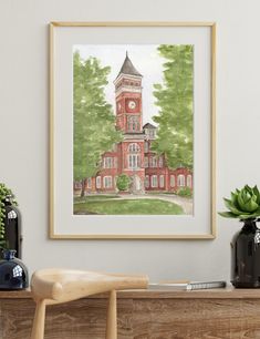 a watercolor painting of a red building with a clock tower