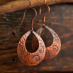 Indulge in copper intricacies with our handcrafted earrings, showcasing meticulous detail and artistic expression in each piece. Artisan Dangle Earrings With Artistic Design, Artisan Earrings With Artistic Design, Artisan Nickel Free Copper Hoop Earrings, Artisan Drop Earrings With Artistic Design, Artisan Teardrop Earrings With Artistic Design, Artisan Copper Hoop Earrings Nickel Free, Artisan Handmade Earrings With Copper Wire, Artisan Round Earrings With Artistic Design, Handmade Copper Drop Earrings