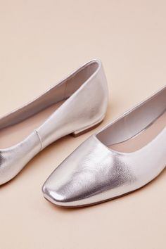 You'll walk for miles in effortlessly chic style with the Lulus Jordane Silver Metallic Ballet Flats! Shiny, pebbled faux leather shapes these must-have shoes that feature a classic ballet flat silhouette with a tapered square toe upper, a low-cut collar, and a simple slip-on design. Available in whole sizes only. 0. 5" rubber heel. Lightly cushioned insole. Rubber sole has nonskid markings. Man made materials. Imported. Lulus | Jordane Silver Metallic Ballet Flats | Size 7. Silver Leather Ballet Flats For Evening, Chic Silver Ballet Flats, Chic Silver Closed Toe Ballet Flats, Silver Slip-on Flats, Metallic Ballet Flats, Silver Leather Slip-on Ballet Flats, Tapered Square, Metal Clothing, Metallic Shoes