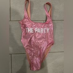 This Is New, Never Worn! I Purchased On Etsy For A Bachelorette Party And Didn’t End Up Wearing It. Can We Worn As A Bathing Suit Or Body Suit. Sparkly Metallic Pink Color. Size S/M. Pink One-piece Bodysuit For Beach Party, Pink Backless One-piece With Lined Body, Pink V-neck Party Bodysuit, 1 Piece Bathing Suit, Pink One-piece Bodysuit For Poolside, Playful Pink Swimming Onesie, Metallic Pink, Private Party, Body Suit