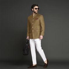 This Jodhpuri Suit is every bit young and smart and is darted to give a well-tailored fit. The coat is tailored from Super 120s Italian wool and paired with white pants made out of Italian milled long staple cotton fabric. The suit has luxurious hand painted buttons from Jaipur. #indianwedding #jodhpurisuitwedding #indiangroomattire #bandhgalasuit #indiangroom #desiwedding #menscustomsuit #affordableluxury #instawedding #indianweddinginspiration # Mens Wedding Wear Indian, Jaipuri Suits, Prince Suit, Indian Wedding Suits Men, Custom Suits Men, Jodhpuri Suits For Men, Mens Indian Wear, Wedding Kurta For Men, Groom Dress Men