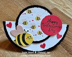 a close up of a card with a bee on the front and happy valentine's day written on it