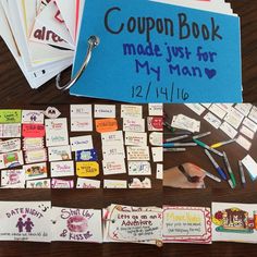 a table topped with lots of different types of coupons and magnets on top of it