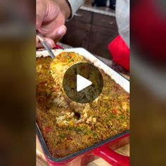 someone is cutting into a casserole dish with a knife