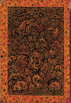 an intricately decorated cloth with animals and flowers