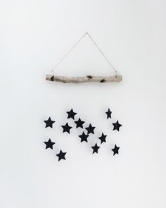 some black stars hanging on a white wall and the words home decor tips above them