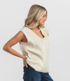 Crafted with a loose, relaxed fit, the Cable Sweater Vest offers both comfort and style. The soft, tactile yarn not only feels incredible against your skin but also adds a touch of texture to your outfit, elevating any look with its effortless charm. Pairs with Cable Sweater Pants as a matching set. Maggie is 5’6” and is wearing a small Cable Sweater Vest in Off White. Casual Sweater Vest For Fall Loungewear, Beige Knit Sweater Vest For Everyday, Casual Soft Knit Beige Sweater Vest, Everyday Beige Knit Sweater Vest, Casual Beige Soft Knit Sweater Vest, Cozy Cable Knit Winter White Tops, Casual Pointelle Knit Sweater Vest For Fall, Casual Beige Textured Knit Sweater Vest, Casual Beige Sweater Vest For Everyday