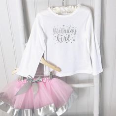 Birthday Outfit Girl/Baby Girl Clothing/First Birthday Shirt/Birthday Shirt Girl/First Birthday Outfit/Baby Girl Clothing/Pink Tutu------------------------------------------------------This is a beautiful sparkly birthday outfit set for a little girl.Super soft cotton long or short sleeve t shirt or baby grow in white, designed by Candy Bows, is embellished with silver glitter vinyl text that spells out 'Birthday Girl' and silver love hearts that shimmer in the light. Our tutu is one size with a First Birthday Girl Outfit, Girls White T Shirt, First Birthday Girl, First Birthday Shirt, Outfit Baby Girl, First Birthday Shirts, Glitter Birthday, Birthday Girl Outfit