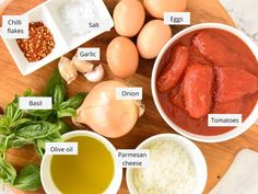 ingredients to make chicken parmesan soup laid out on a cutting board with labels