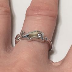 Hawaiian Baby Humpback Whale Ring, Christmas gift, Birthday gift, Anniversary gift, Valentine Present, Mother's Day gift Sterling Silver Ring, Stamped 925 Silver Ring Width: 8 mm This ring arrives in a beautiful gift box. Model #: R2369 Whale (Kohola) The whales symbolize the circle of life. During the winter and spring season, the humpback whales migrate to Hawaii and give birth to their young. For thousands of years, the whales have been a spiritual guide for the Hawaiian people. Whale Ring, Hawaiian Bracelets, Hawaiian Necklace, The Circle Of Life, Spiritual Guide, Valentines Presents, Birthday Mom, Mother Birthday, Gift Valentine