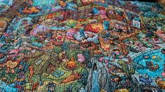 this is a very large puzzle with many different pictures on it's surface,