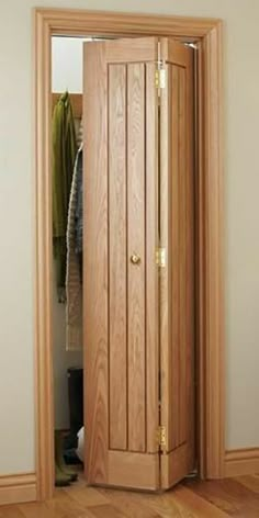 an open wooden door in the corner of a room