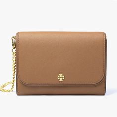 This Tory Burch Emerson Chain Wallet Leather Cross Body Bag Is A Versatile Accessory Suitable For Any Occasion. The Bag Features A Magnetic Snap Closure, A Detachable Strap, And A Convertible Design That Allows It To Be Worn As A Crossbody Or Over-The-Shoulder. It Is Made Of High-Quality Leather With A Jacquard Lining And Metal Hardware, Ensuring Durability And Style. The Bag Has A Medium Size And A Solid Pattern, Making It A Perfect Addition To Any Outfit. It Has Multiple Pockets And Inner Divi Elegant Brown Wallet With Chain Strap, Classic Tan Wallet On Chain For Formal Occasions, Elegant Brown Wallets With Chain Strap, Classic Gold Wallet On Chain For Travel, Elegant Tan Wallet On Chain With Gold-tone Hardware, Classic Brown Wallet On Chain With Chain Strap, Elegant Brown Wallet On Chain With Detachable Strap, Classic Brown Wallet On Chain, Elegant Brown Wallet On Chain For Travel