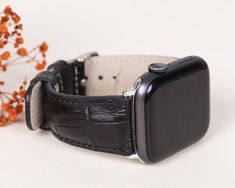 "Personalized Leather Apple Watch Band, men/women Strap for iWatch 8 7 6 5 4 3 2 1 & SE, Fitbit Charge 5/4 Watch Band, Versa 4 3 2 1 Band ✽ PRODUCT DETAILS ✽ *Our Apple Watch & Fitbit Series band is 100% Premium Genuine Leather. *Our bands are compatible with Apple Watch 8 7 6 5 4 3 2 1 & SE and Fitbit Versa 4 3 2 1 & SENSE & Charge 5 & Charge 4. *It will always add elegance to you with its elegant design. *Fully compatible with your watch. *We have 7 different connector colors for your watches: Silver, Gold, Rose Gold, Black, Extend Grey, Red and Blue. Adapter color and buckle color must be the same. **Our Rivet colors are Silver, gold and rose gold. ✽ SIZE DETAILS ✽ *Our Genuine Leather Watch Band fits 155 - 200mm (6.1\" - 8.0\") wrists. We can make a custom band with a different price. Black Adjustable Rectangular Watch Bands, Luxury Black Apple Watch Band, Luxury Adjustable Black Apple Watch Band, Luxury Rectangular Black Band Watch Accessories, Modern Apple Watch Band As Gift, Luxury Black Adjustable Apple Watch Band, Rectangular Watch Accessories With Black Band As Gift, Fitbit Versa 4, Apple Watch 8