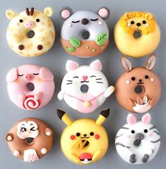 there are many donuts that look like animals on the same face as each other