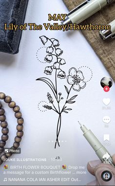 an image of a flower drawn on paper next to a pen and some other items