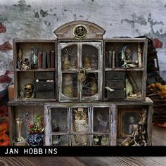 an old bookcase with many pictures on it and the words jan hobbins above it