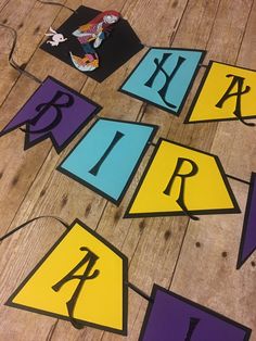 the letters are cut out and laid out on the floor to make it look like they have been painted