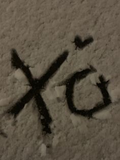 the word go written in snow on top of a white surface with black letters and two small birds